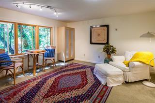 11025 Riverside Road Brookdale, CA 95005 - Photo 22 of 30 a bedroom with a bed and large windows
