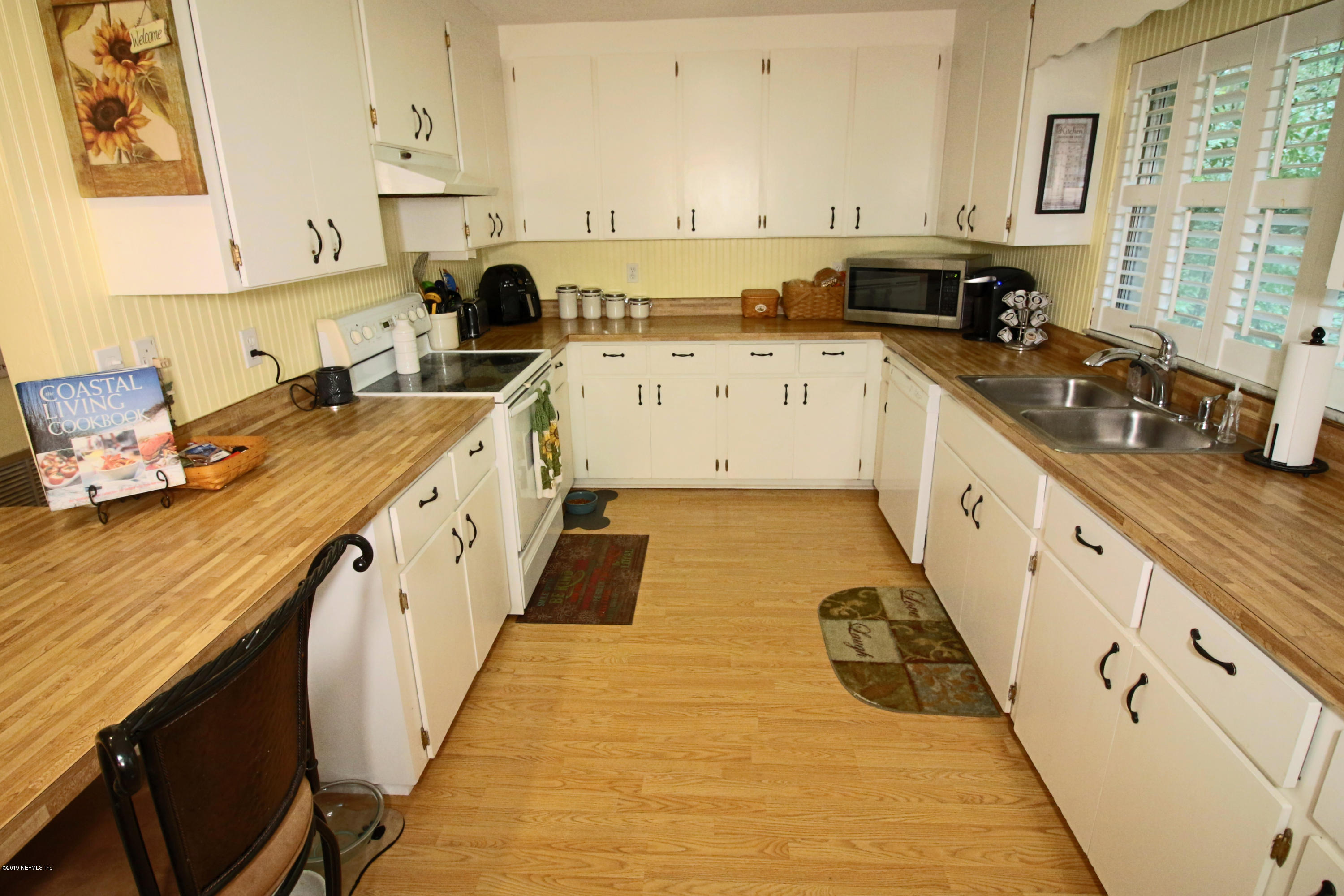 6606 Brooklyn Bay Road Keystone Heights, FL 32656 - Photo 12 of 62 a kitchen with a sink a stove and cabinets