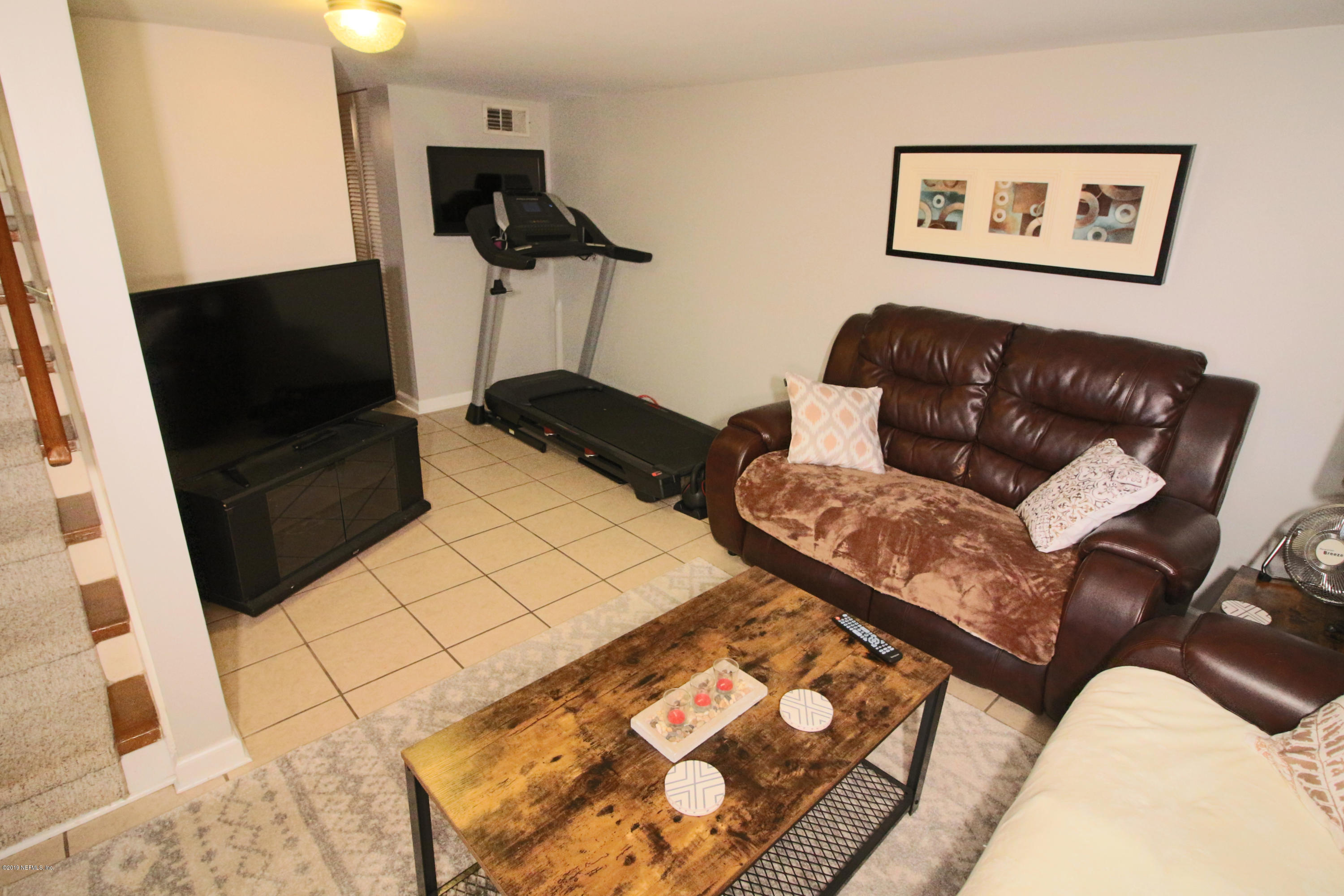 6606 Brooklyn Bay Road Keystone Heights, FL 32656 - Photo 33 of 62 a living room with furniture and a flat screen tv