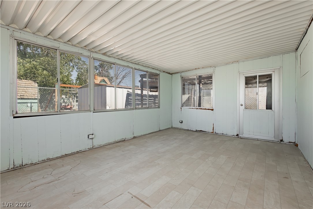 306 Dell Way Henderson, NV 89015 - Photo 19 of 29 Sunroom with Door from Primary Bedroom in Back