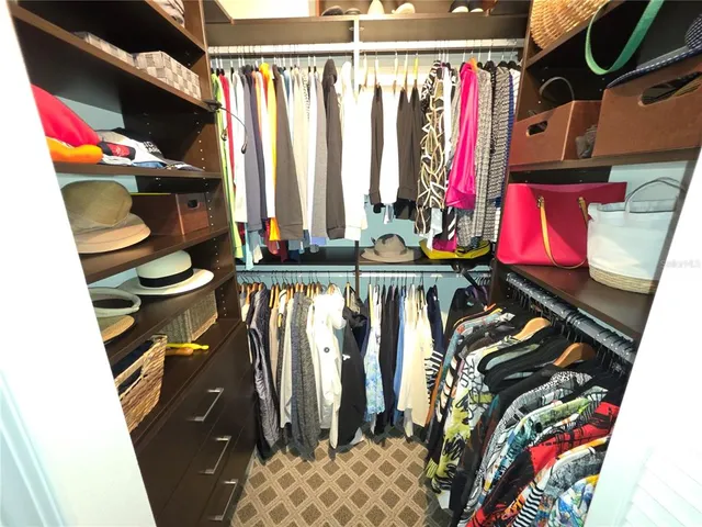 a bathroom with a sink mirror and vanity