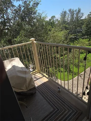 a view of a city with lush green forest