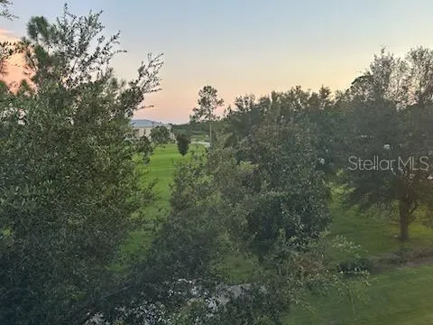 a view of a wooden deck with furniture