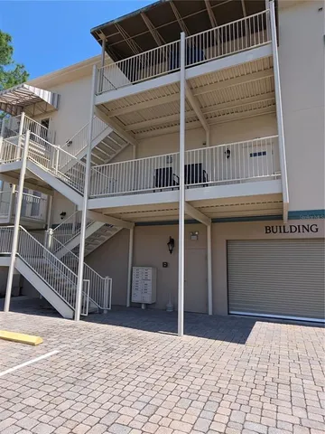 a view of a car parked in front of a building