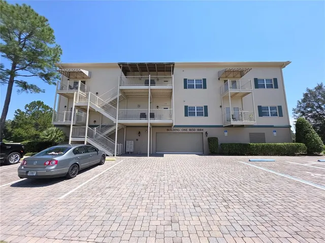 a kitchen with sink and cabinets