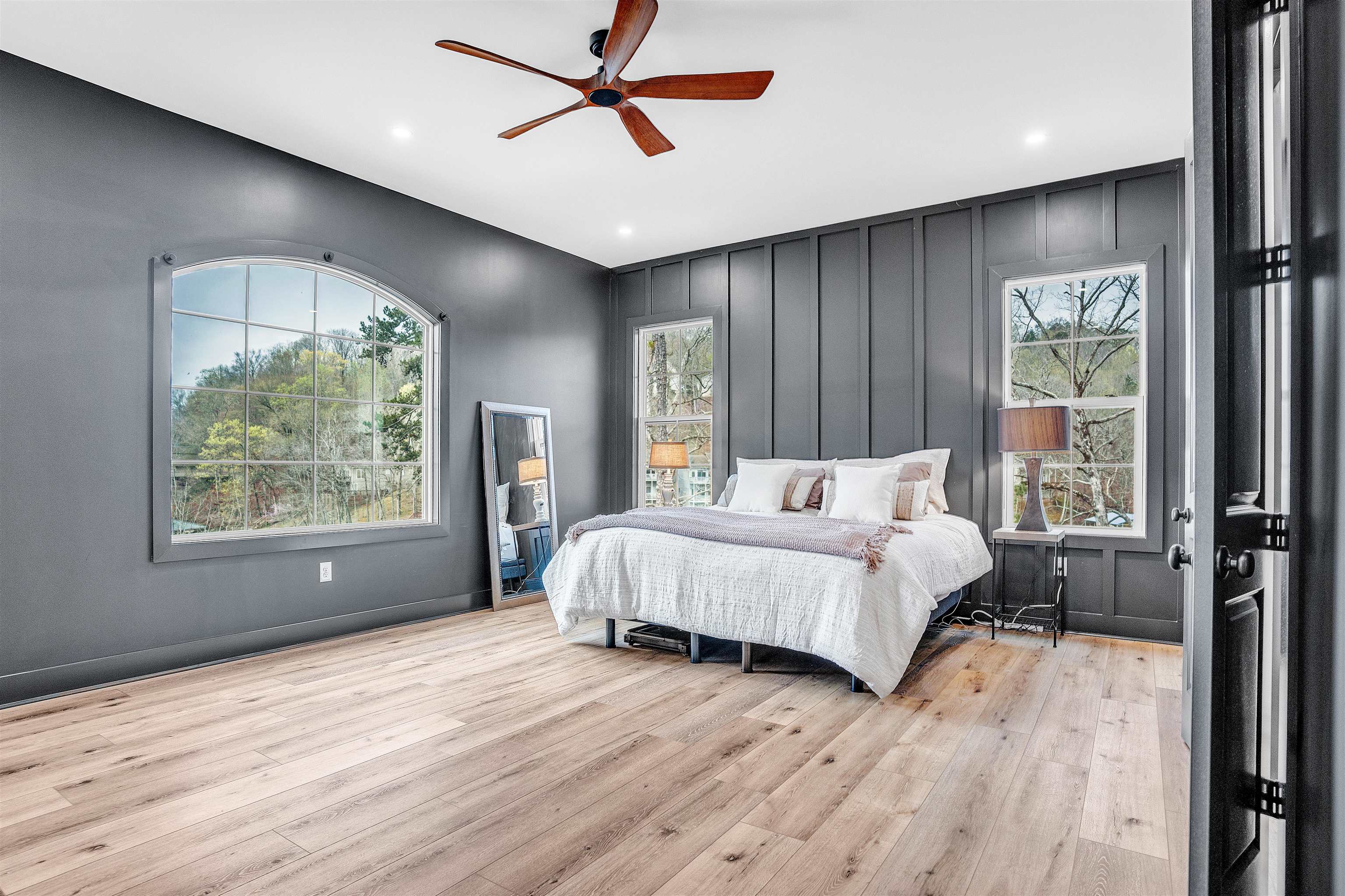 70 Native Leaf Cove Savannah, TN 38372 - Photo 14 of 40 a spacious bedroom with a large bed and a window