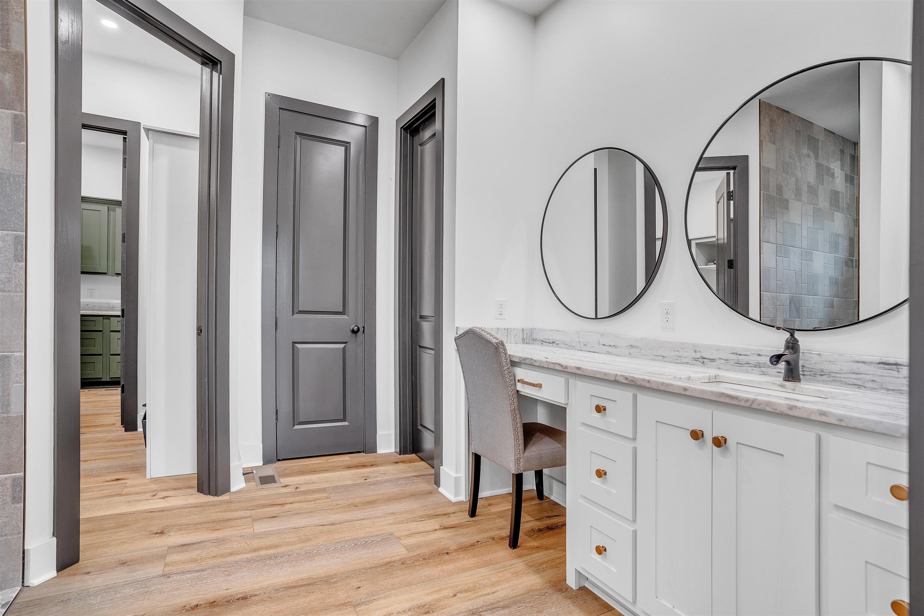 70 Native Leaf Cove Savannah, TN 38372 - Photo 15 of 40 a bathroom with a granite countertop double vanity sink and a mirror