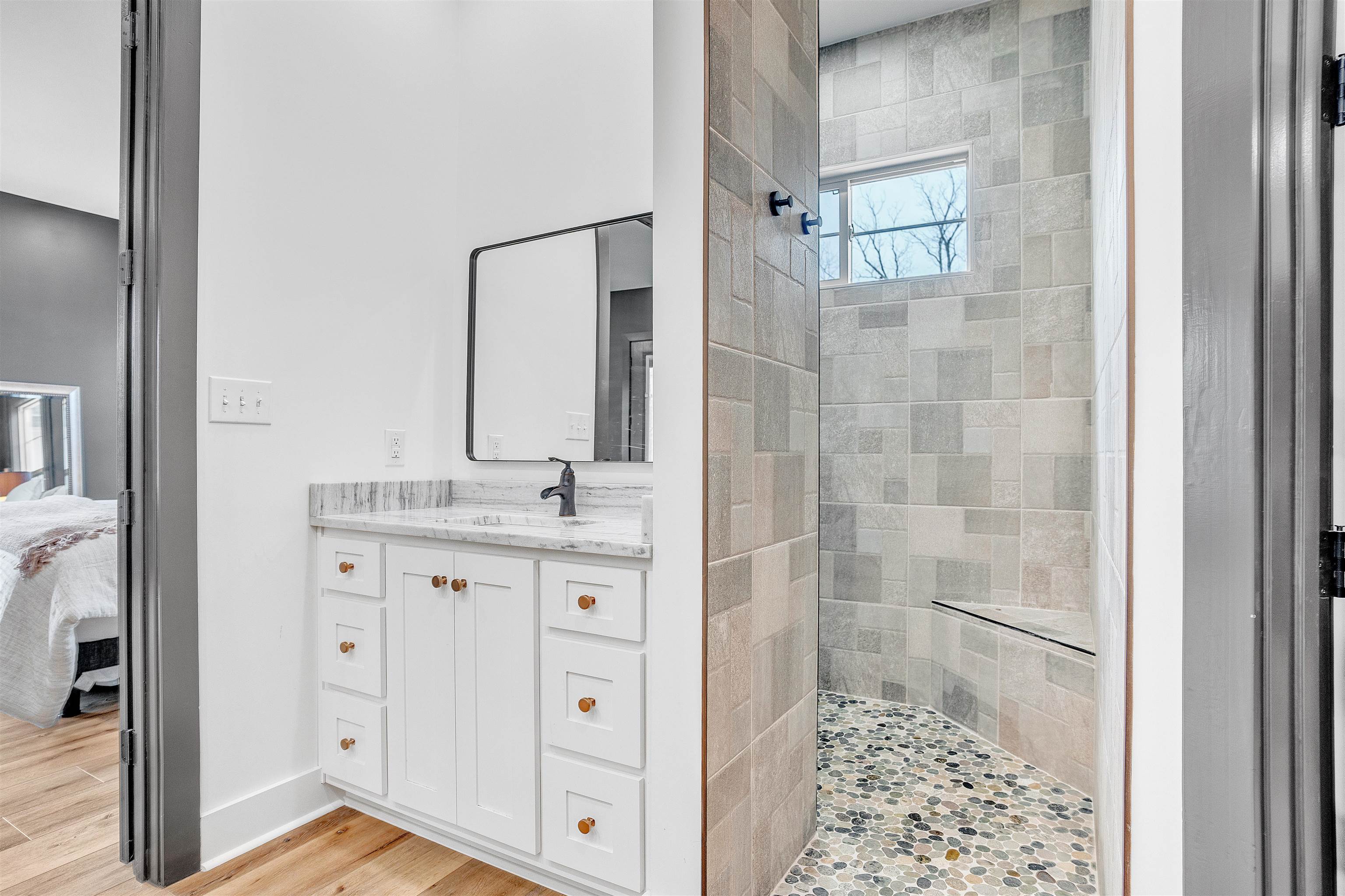 70 Native Leaf Cove Savannah, TN 38372 - Photo 16 of 40 a bathroom with a shower and a sink