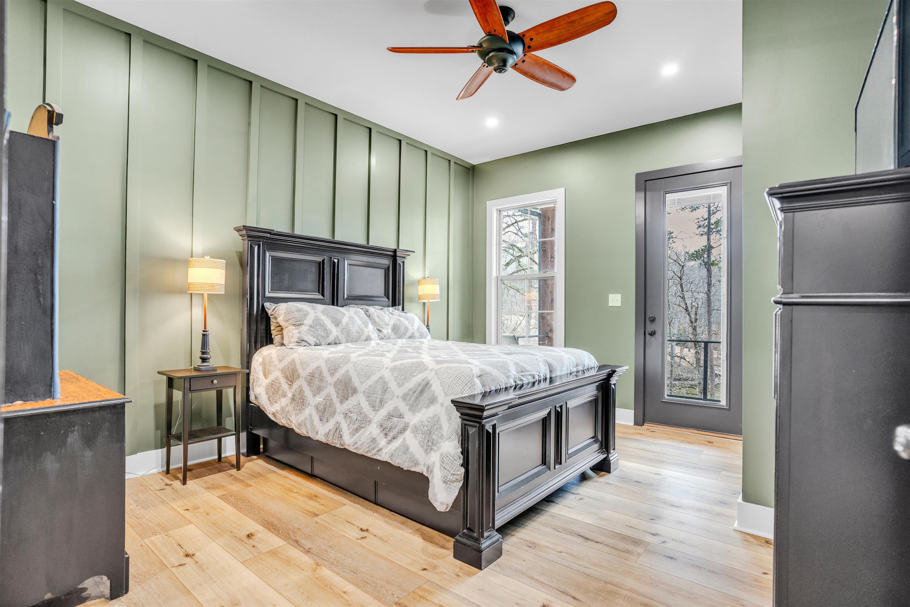 70 Native Leaf Cove Savannah, TN 38372 - Photo 17 of 40 a bed room with a bed and a ceiling fan
