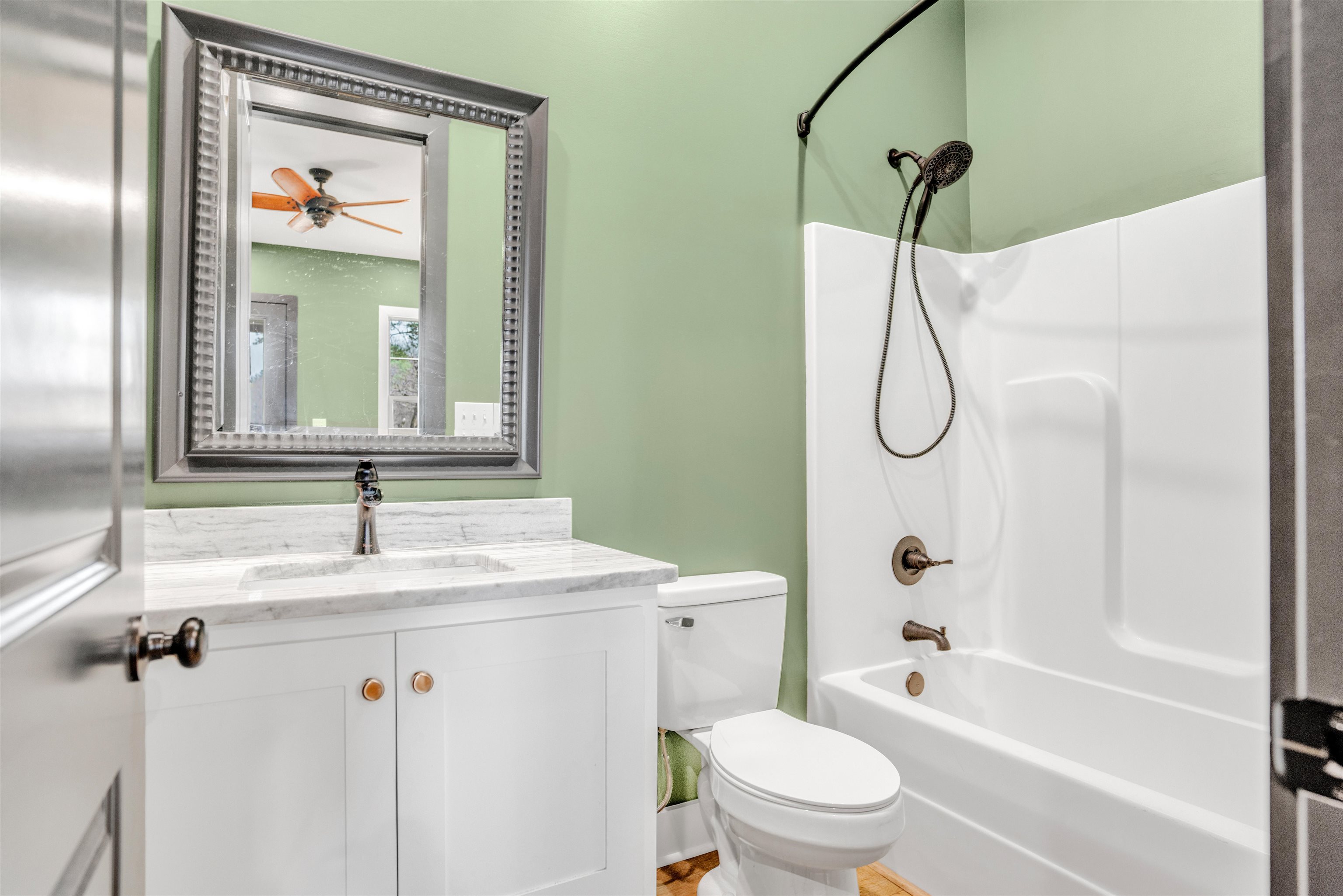 70 Native Leaf Cove Savannah, TN 38372 - Photo 18 of 40 a bathroom with a sink a toilet and shower