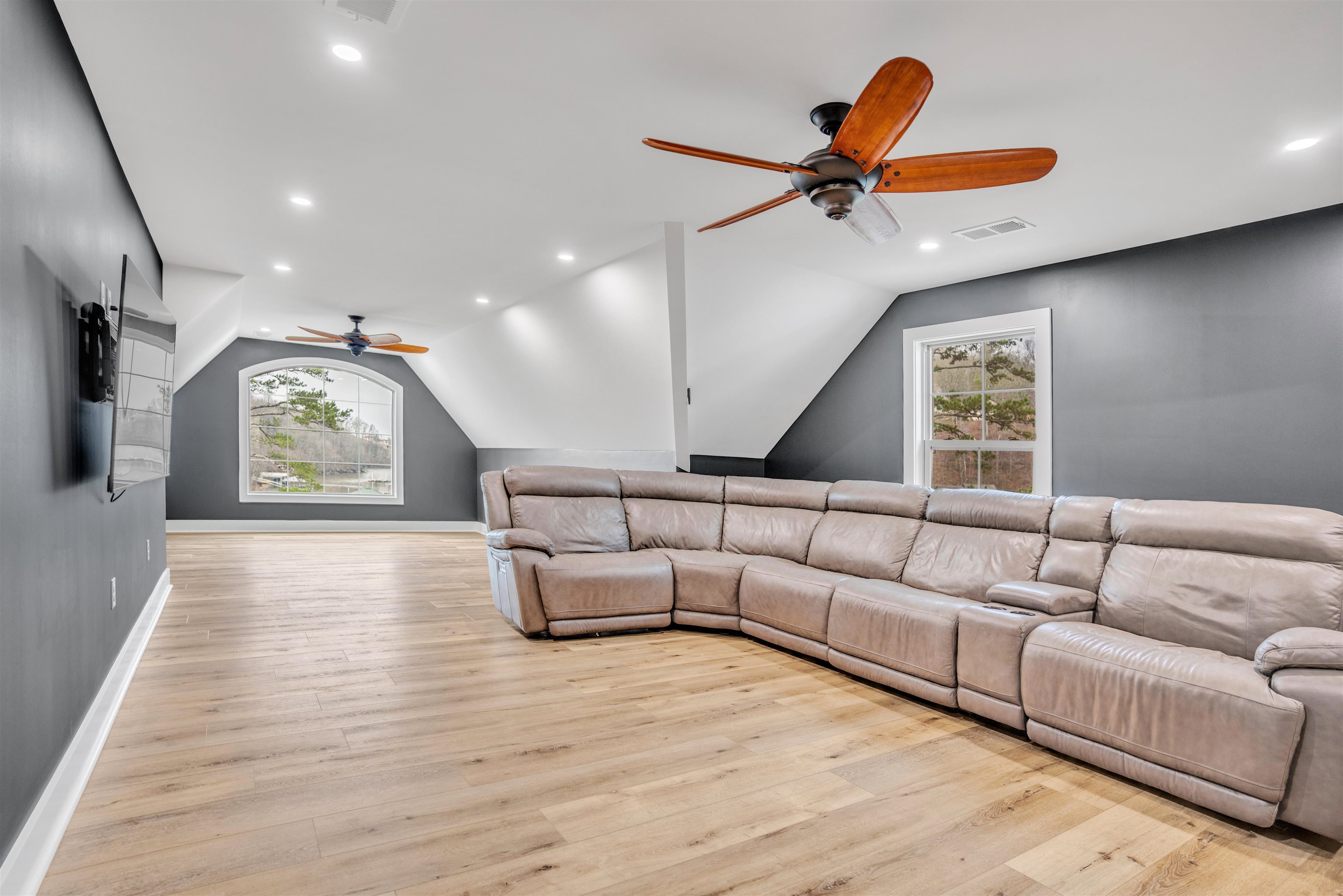70 Native Leaf Cove Savannah, TN 38372 - Photo 23 of 40 a living room with furniture and a large window
