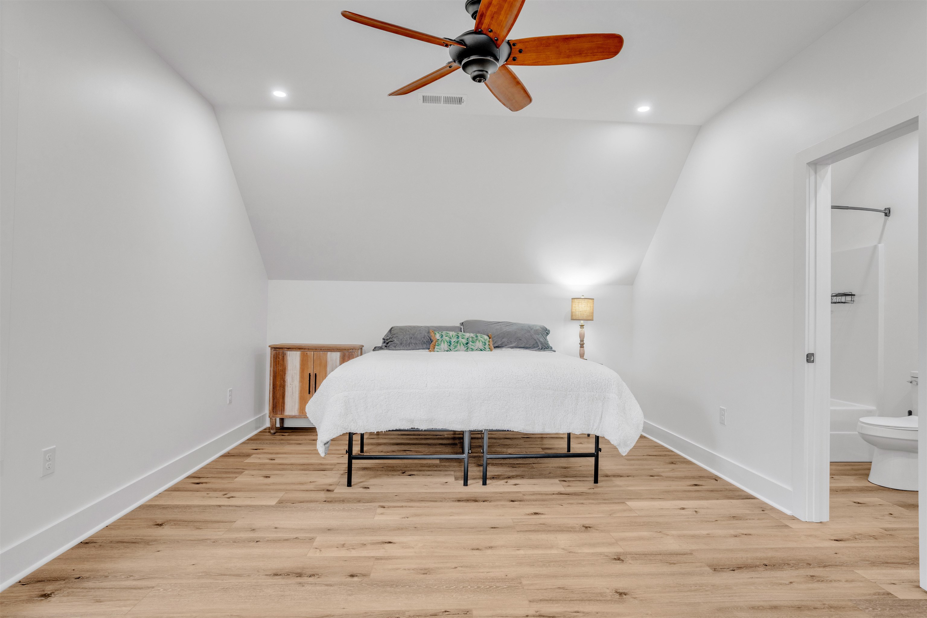 70 Native Leaf Cove Savannah, TN 38372 - Photo 26 of 40 a bedroom with a bed and a table