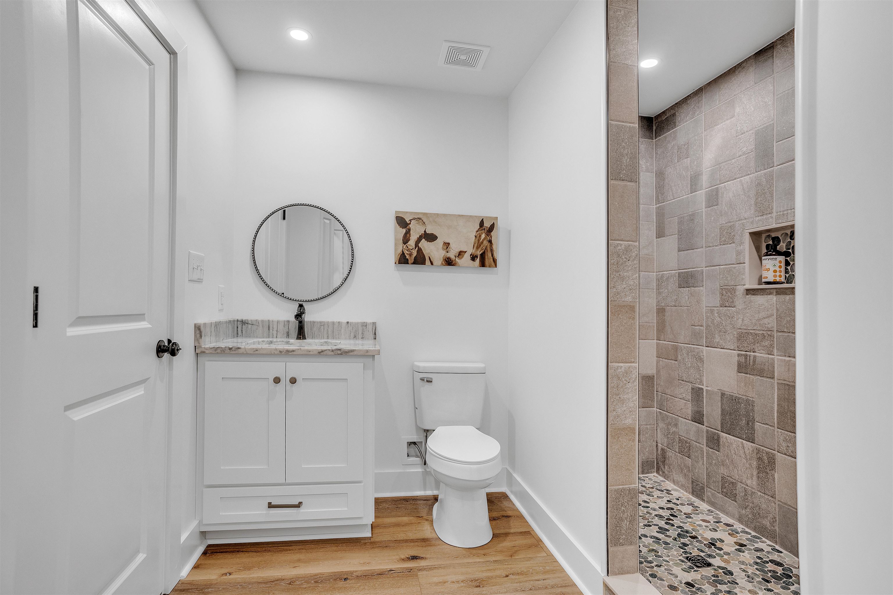 70 Native Leaf Cove Savannah, TN 38372 - Photo 29 of 40 a bathroom with a toilet a sink and mirror