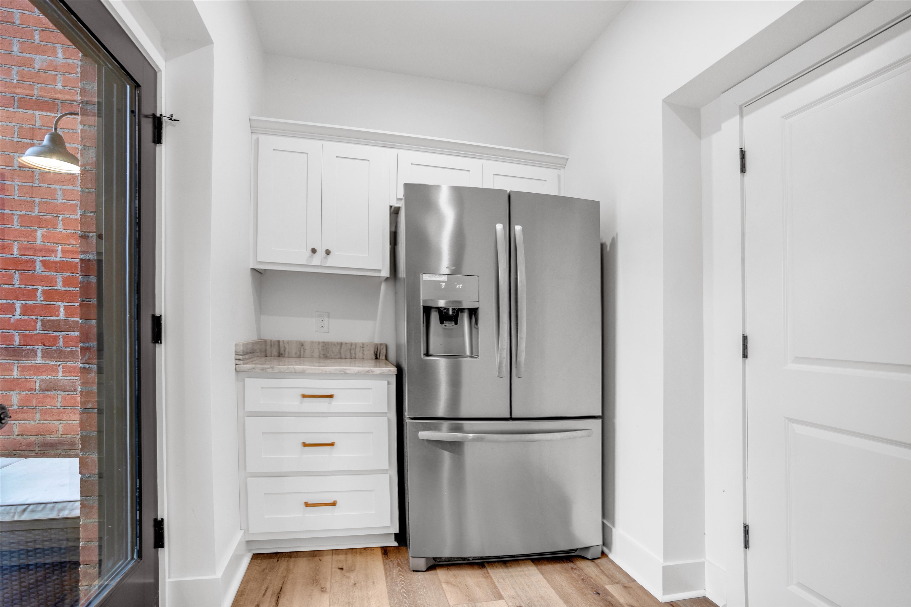70 Native Leaf Cove Savannah, TN 38372 - Photo 30 of 40 a white refrigerator freezer and a stove sitting inside of a kitchen