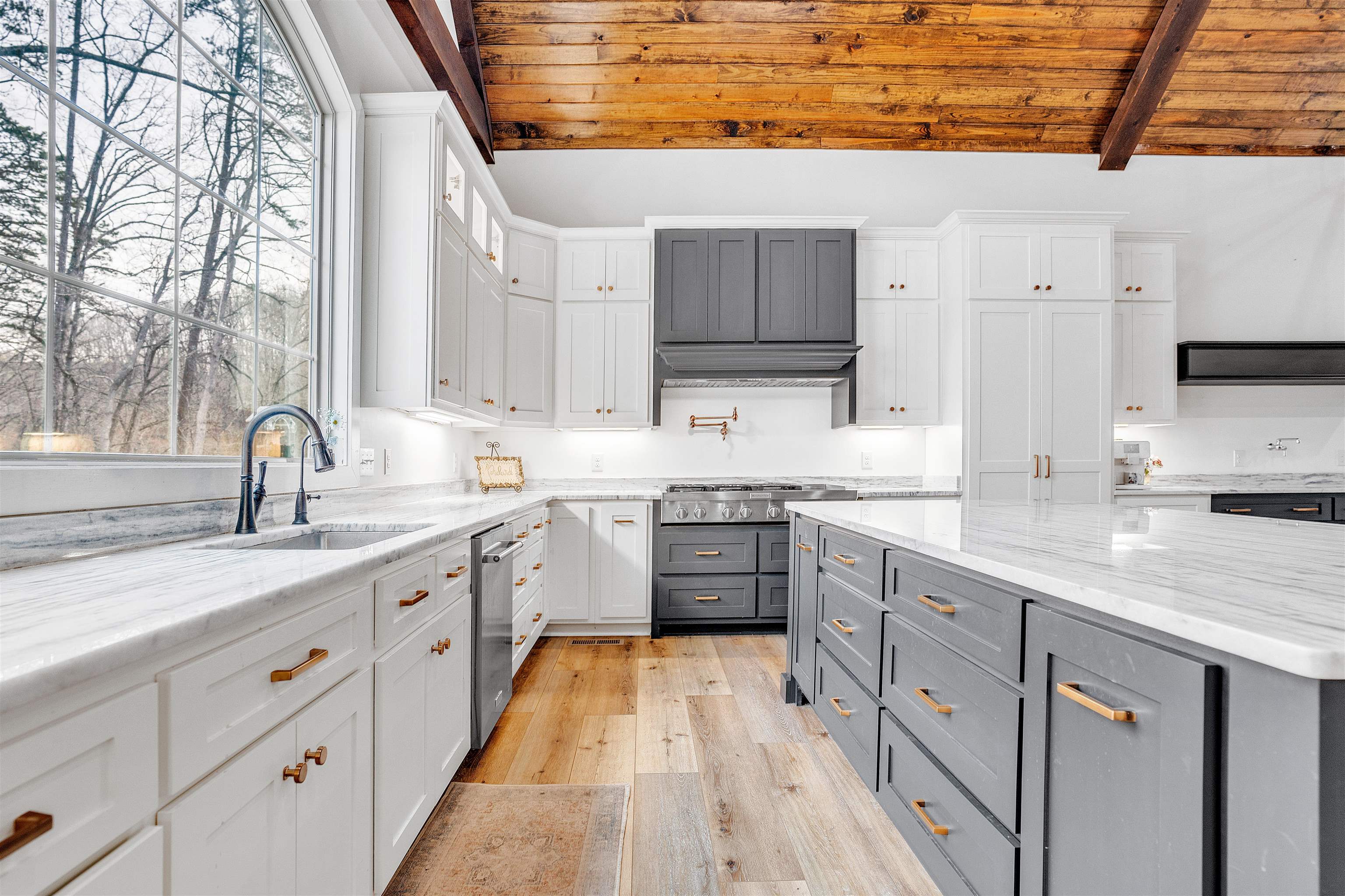70 Native Leaf Cove Savannah, TN 38372 - Photo 8 of 40 a kitchen with cabinets appliances and a sink