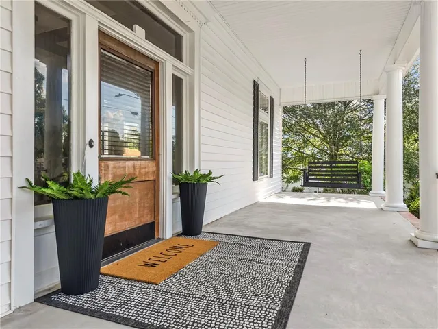 a living room with furniture a fireplace and a table