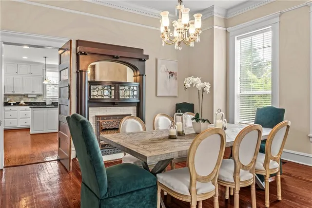 a kitchen with granite countertop white cabinets and a stainless steel appliances