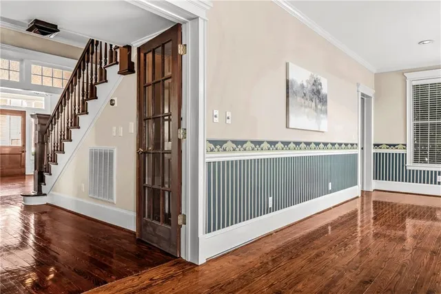a bathroom with a granite countertop sink a mirror and a shower