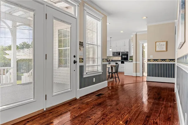 a bathroom with a bathtub and a window