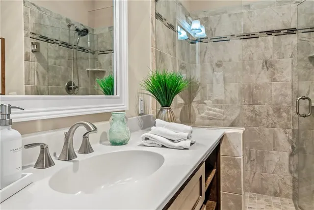 a living room with furniture and floor to ceiling windows