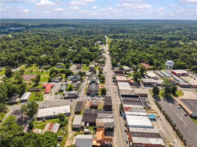 an aerial view of a house with a swimming pool