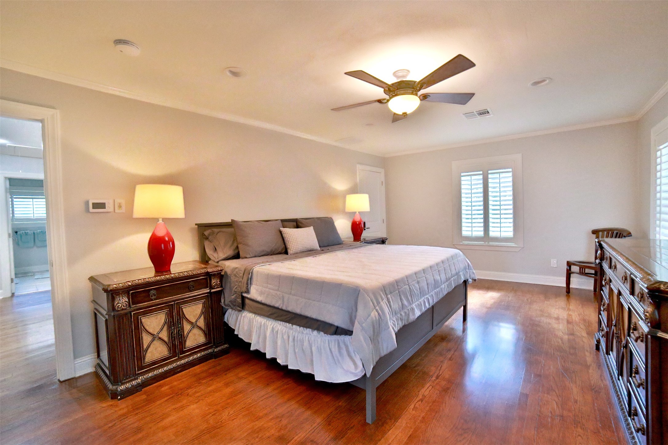 2625 Peckham Street Houston, TX 77098 - Photo 14 of 27 a bedroom with a bed and a chandelier