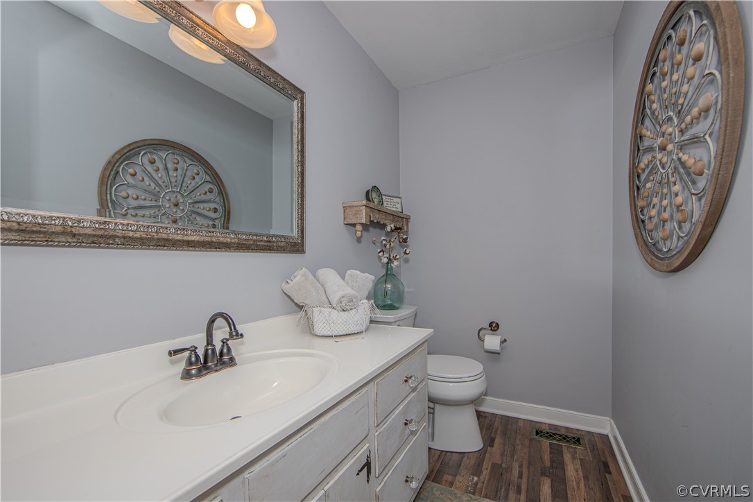 13717 Winterberry Ridge Midlothian, VA 23112 - Photo 26 of 29 a bathroom with a toilet a sink and mirror