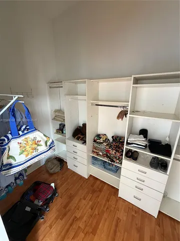 an empty room with windows and entrance