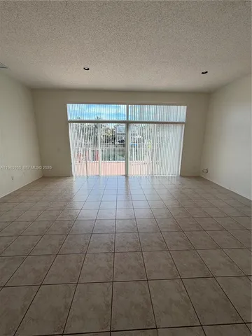 a room with a sink and cabinets