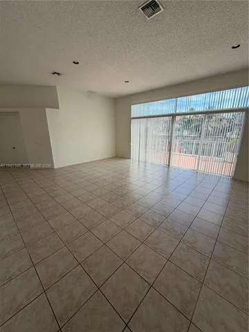 a kitchen with stainless steel appliances a refrigerator sink and cabinets