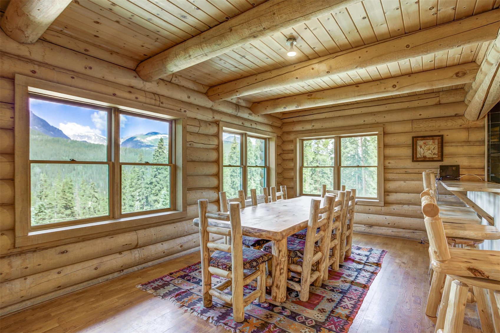 963 Range Road Breckenridge, CO 80424 - Photo 6 of 33 Spacious dining area for a great meal or fun board game with your family and friend while enjoying beautiful Mountain views of iconic Colorado 14er - Mnt. Quandary.