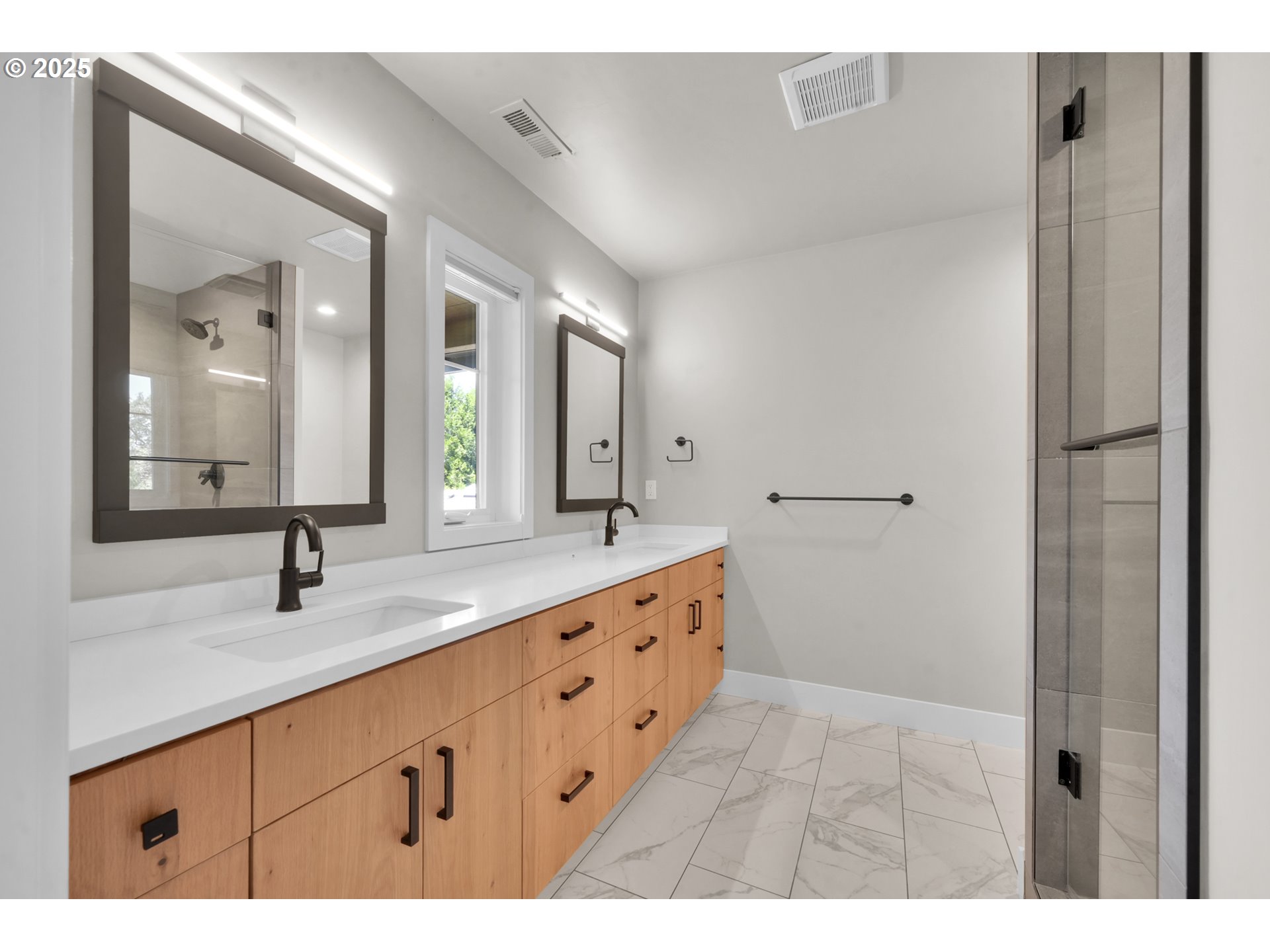 1915 Elkhorn Drive Eugene, OR 97408 - Photo 18 of 28 a bathroom with a double vanity sink and a mirror