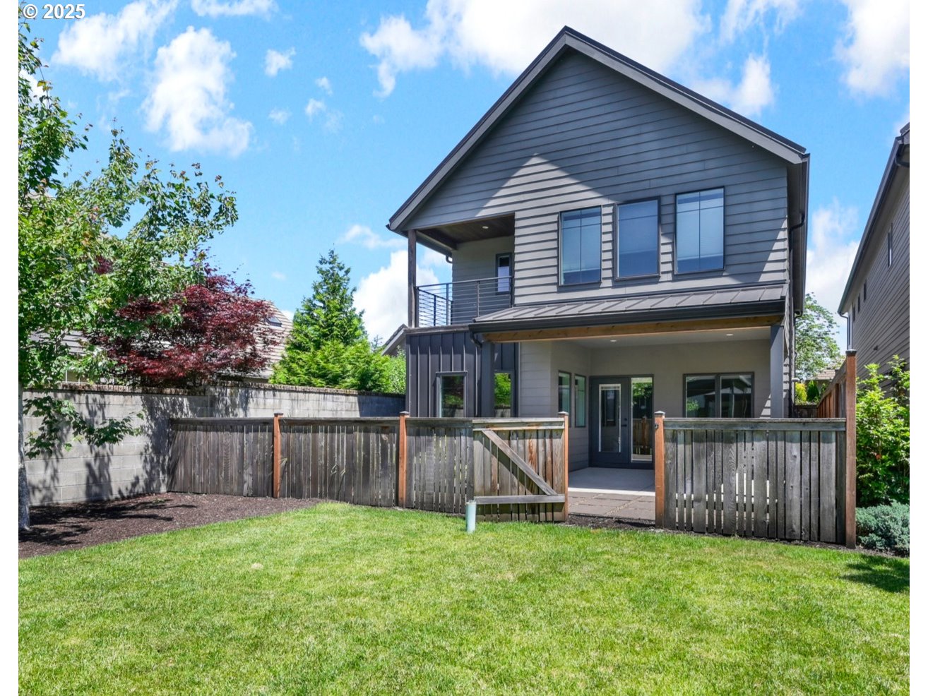 1915 Elkhorn Drive Eugene, OR 97408 - Photo 26 of 28 a view of a house with a yard and a wooden fence