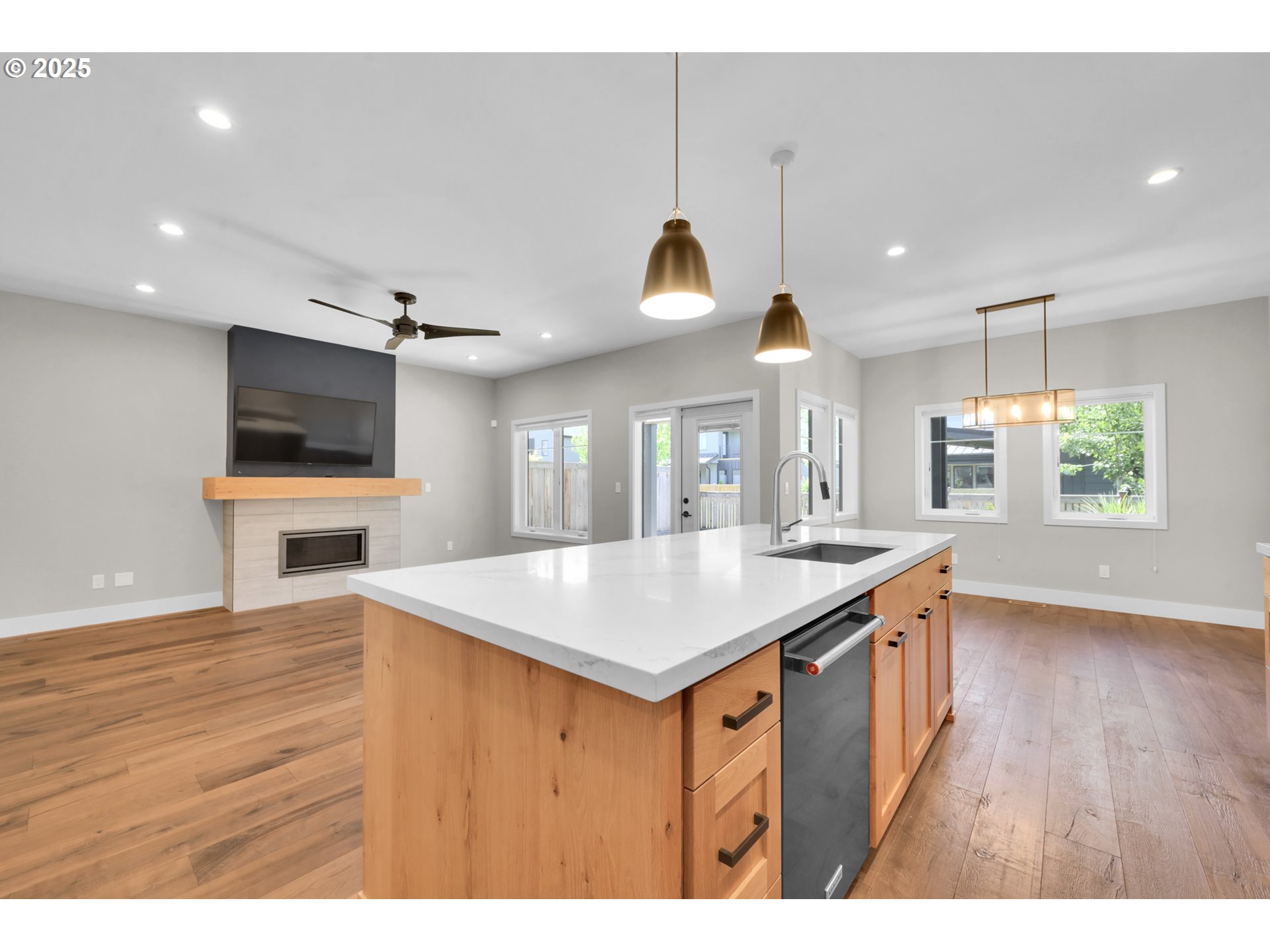 1915 Elkhorn Drive Eugene, OR 97408 - Photo 6 of 28 a kitchen with a wooden floor and a view of living room
