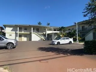 a view of a car parked in front of a building