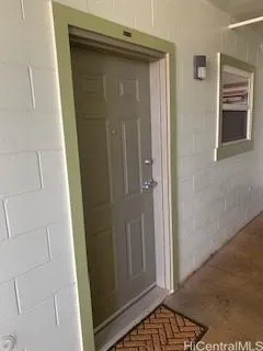 an entryway with a hardwood floor