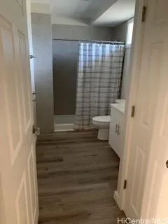 a white toilet sitting next to a bathroom sink