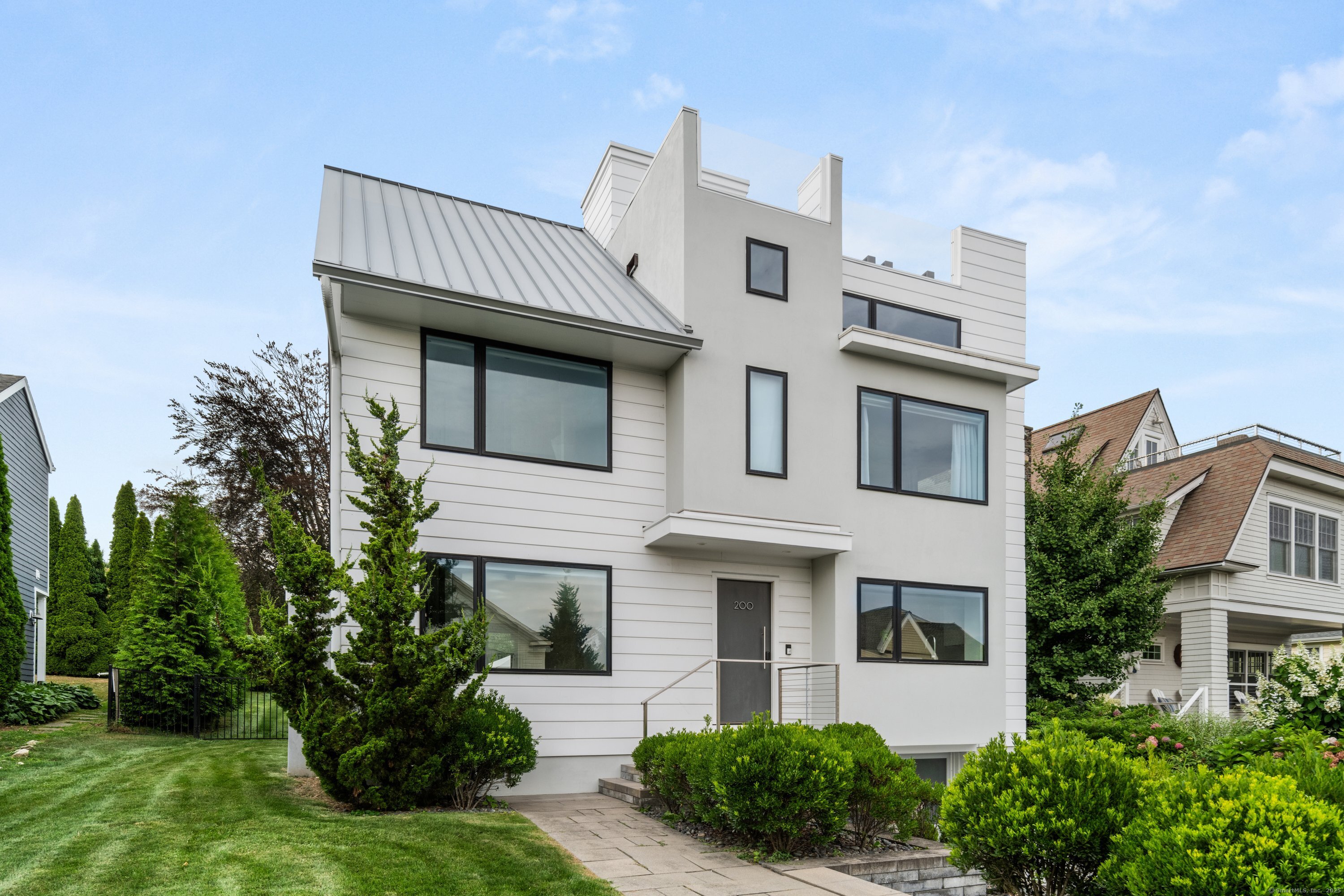 a front view of a house with garden