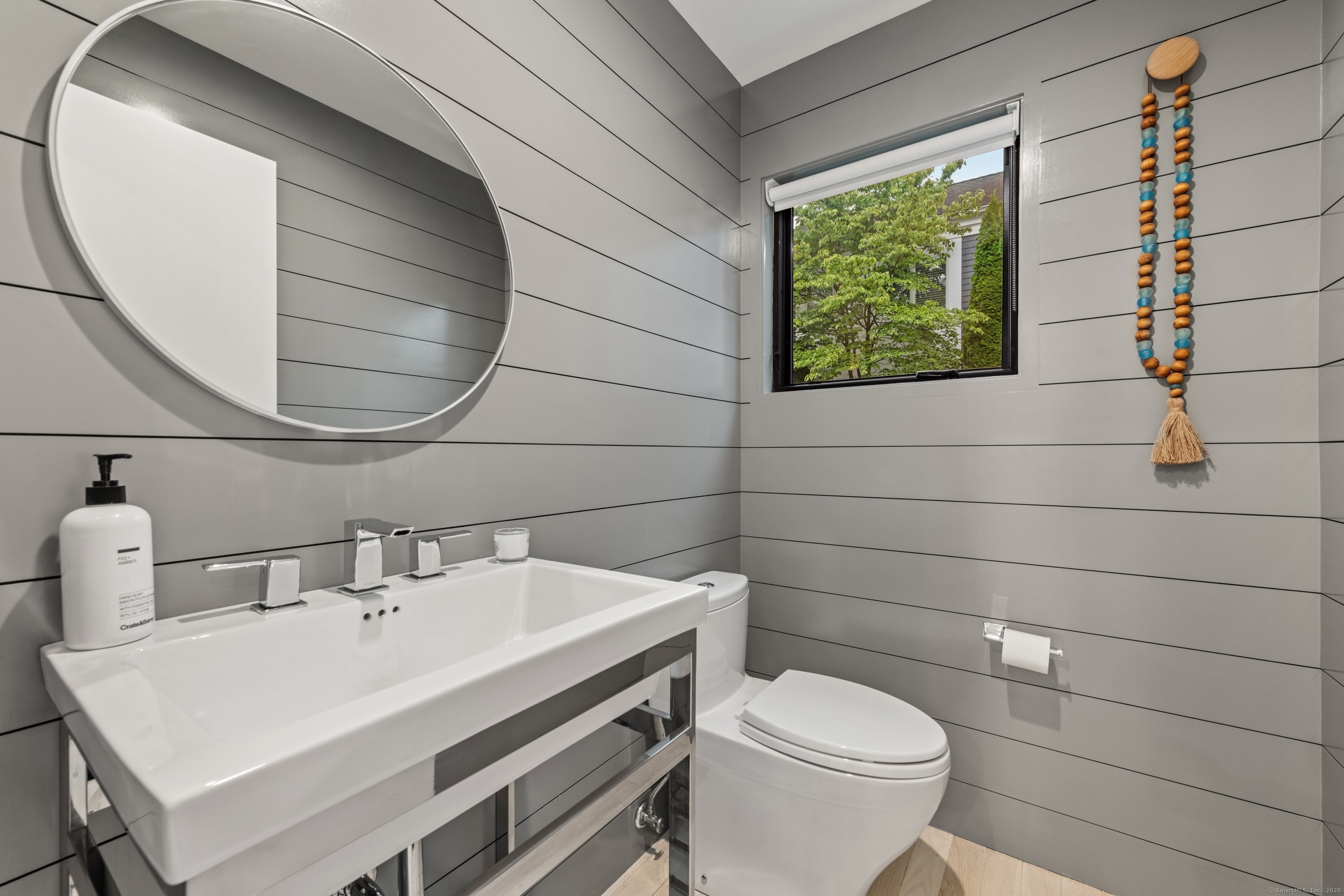 200 Hillspoint Road Westport, CT 06880 - Photo 19 of 37 a bathroom with a sink a toilet and a mirror