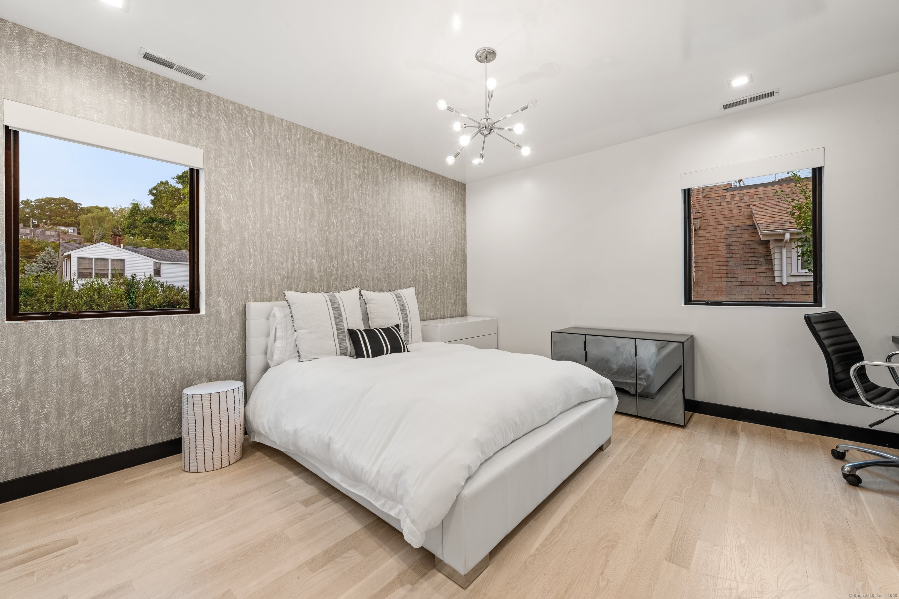 200 Hillspoint Road Westport, CT 06880 - Photo 23 of 37 a large white bed in a white room