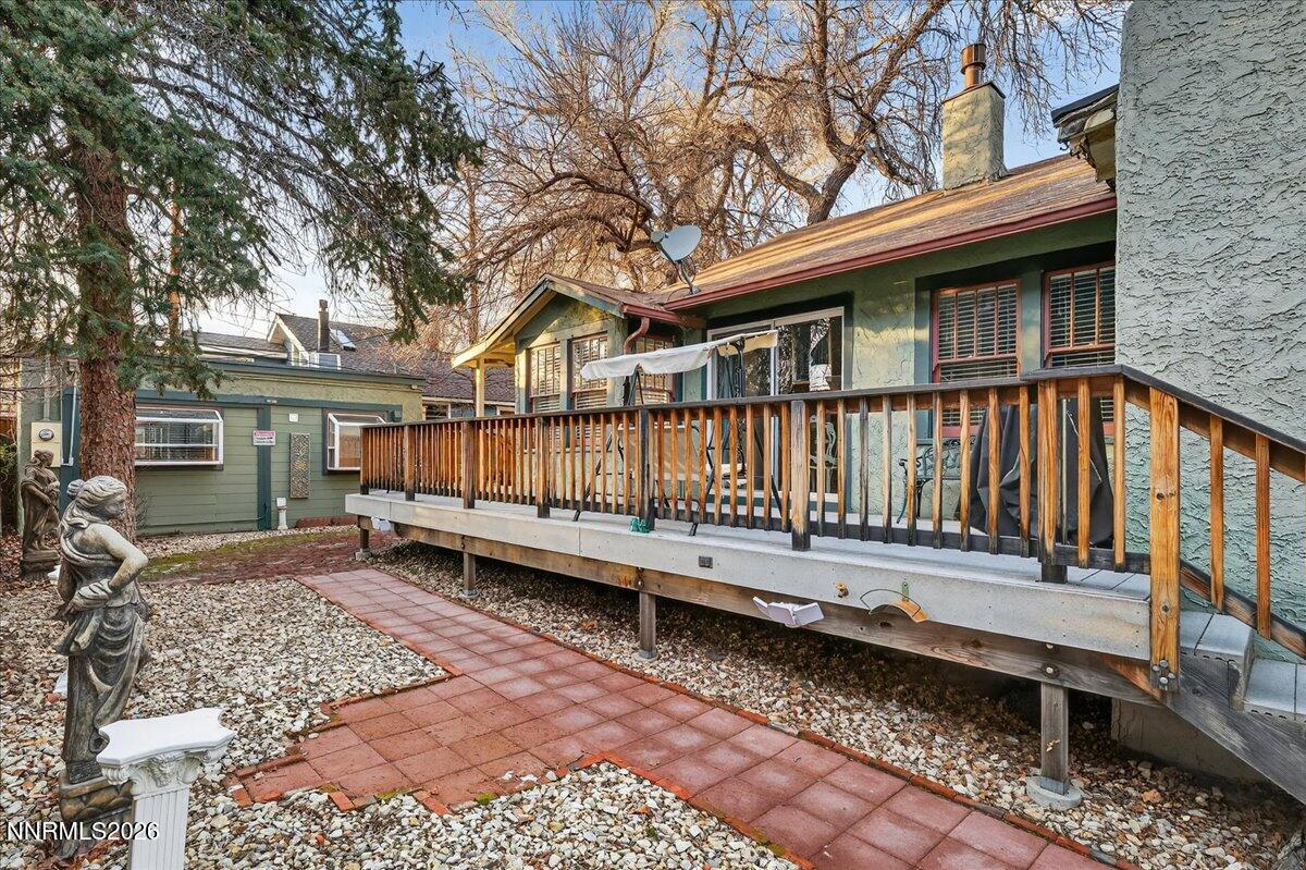 611 Nixon Avenue Reno, NV 89509 - Photo 14 of 43 a view of a house with a wooden deck and furniture