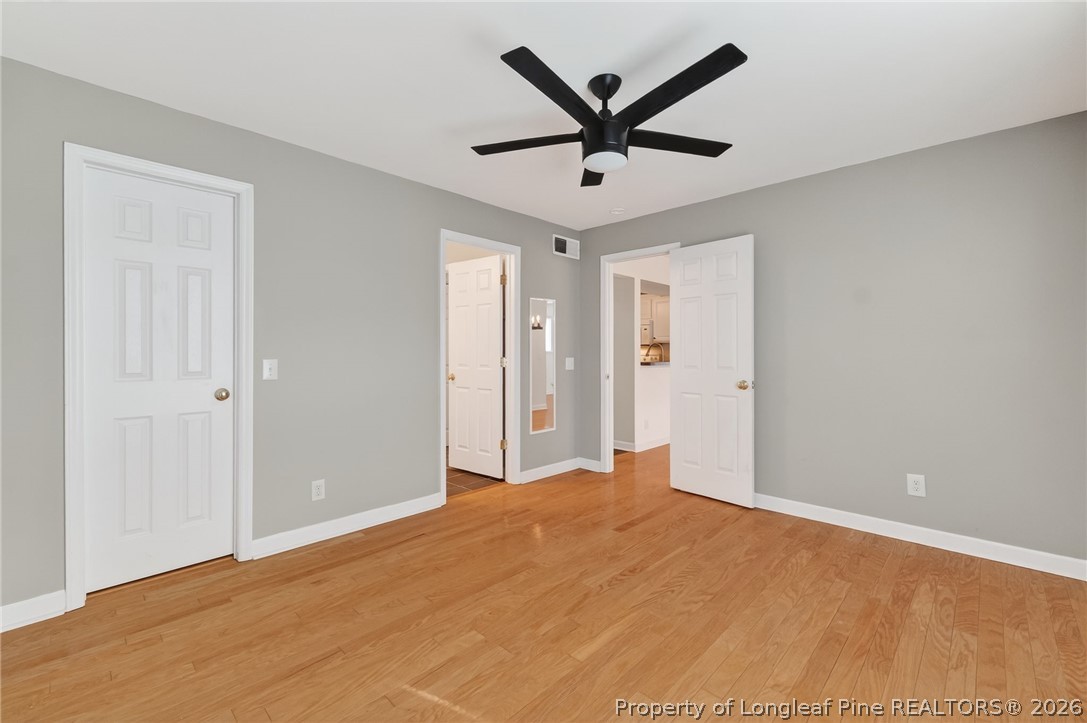 1221 Westview Lane, Unit 301 Raleigh, NC 27605 - Photo 17 of 32 a view of a big room with wooden floor and windows