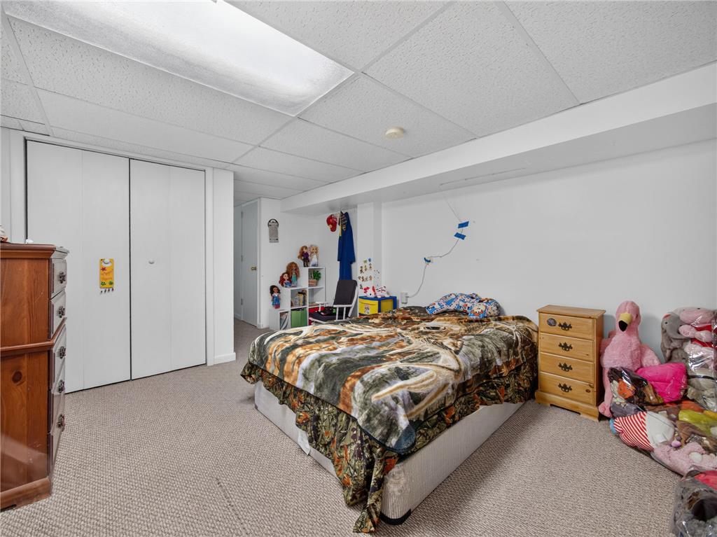 3046 Ridon Court Bethlehem, PA 18020 - Photo 35 of 41 A well-lit bedroom provides comfortable living with carpeted flooring and practical closet storage.