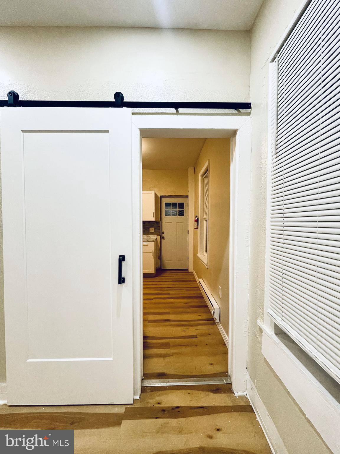 3151 G Street, Unit A Philadelphia, PA 19134 - Photo 1 of 6 a view of a hallway with wooden floor and staircase