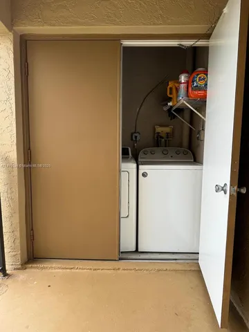 a kitchen with stainless steel appliances granite countertop a refrigerator stove and sink