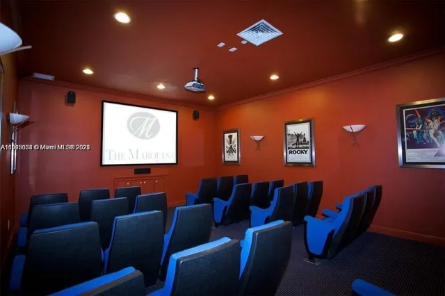 a media room with lots of chairs and a projector screen