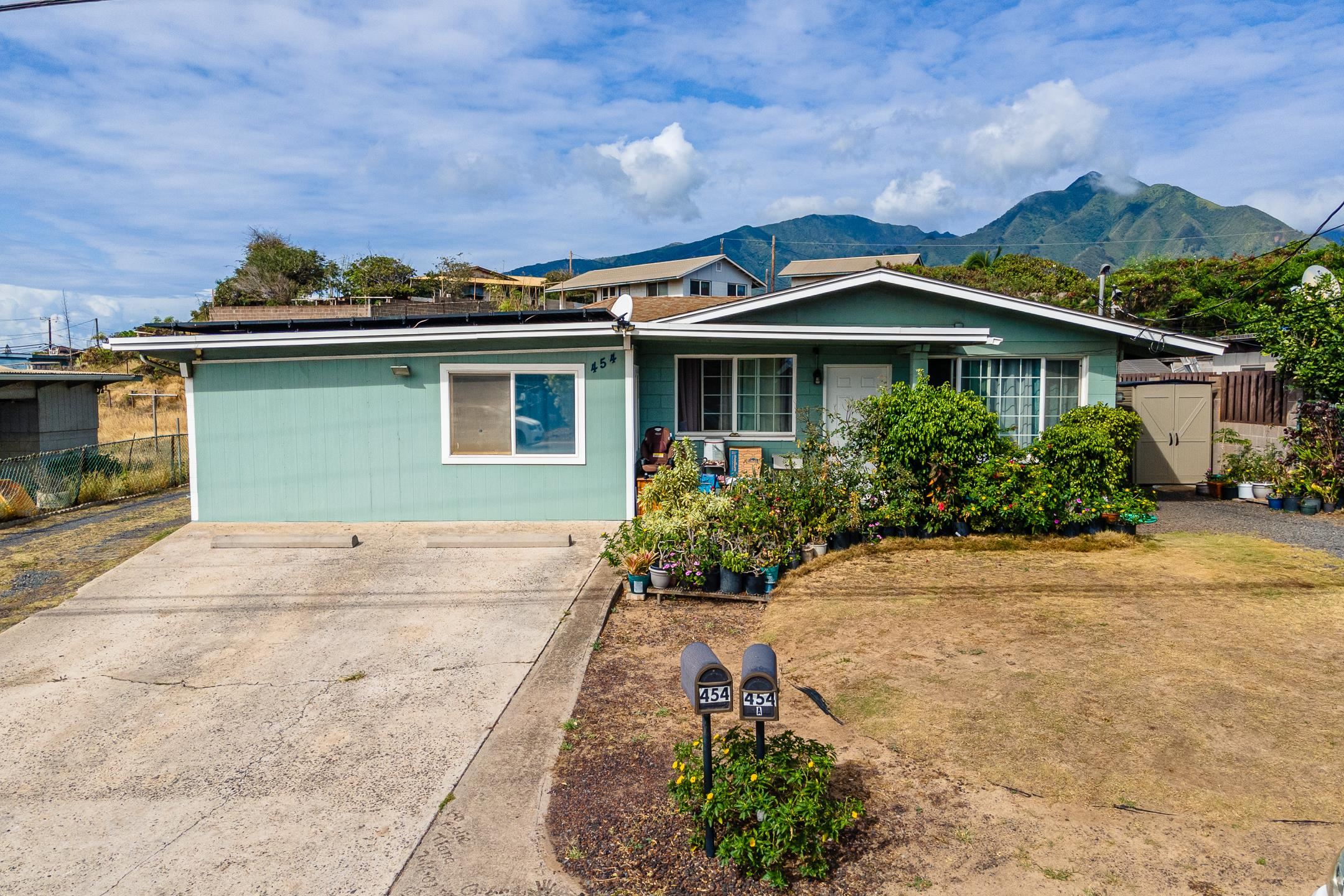 front view of a house with a yard