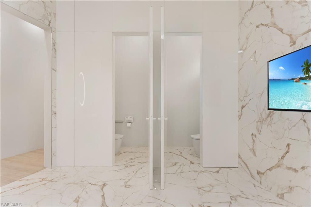2485 Crayton Road Naples, FL 34103 - Photo 16 of 33 His/Her Water Closets
