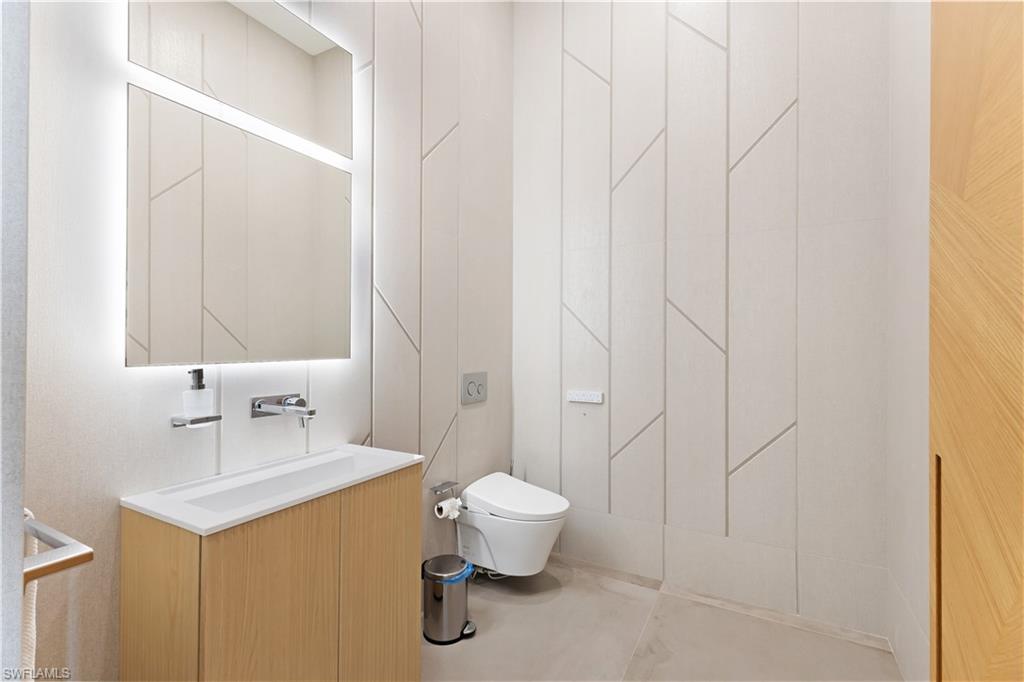 2485 Crayton Road Naples, FL 34103 - Photo 25 of 33 Front Entrance Half Bath