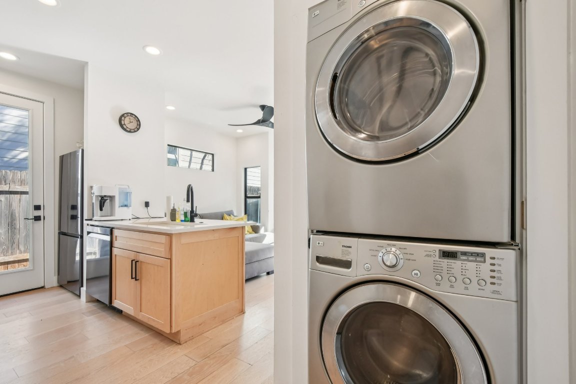 2916 East 13th Street, Unit 2 Austin, TX 78702 - Photo 11 of 35 Washroom featuring light wood-style floors, recessed lighting, and stacked washer and clothes dryer